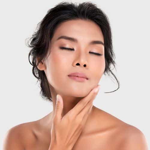 Gorgeous woman touches her face promoting the PDO Thread Lift Results available in Rancho Cucamonga, Hesperia, and Redlands, California