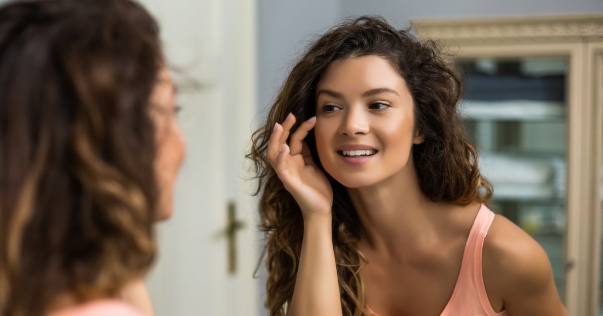 woman looking in a mirror