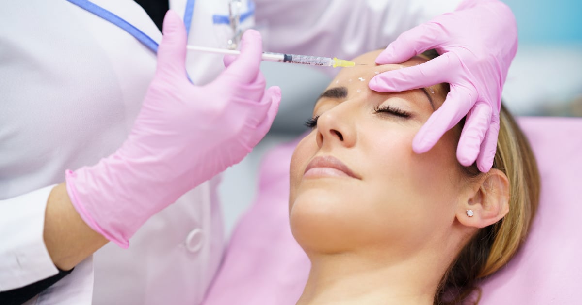 woman getting botox for frown lines